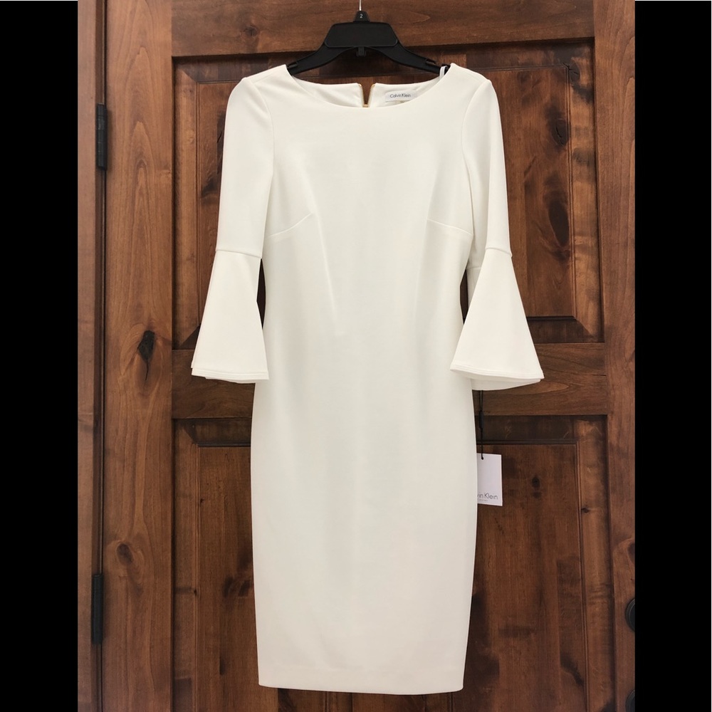 White Calvin Klein bell sleeve dress